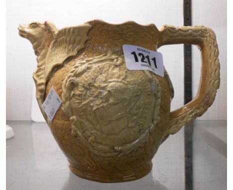 A late 19th Century Edward Bingham Castle Hedingham Pottery jug decorated in the antiquarian style with applied sprigging of 