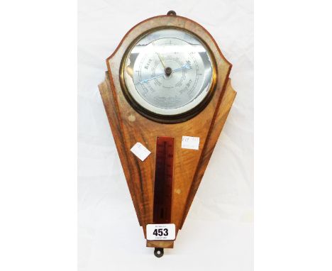 A vintage walnut veneered Art Deco style wall barometer/thermometer with aneroid works by Comitti of London