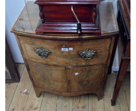 A 62cm antique mahogany and strung bow front commode chest with long drawer over a double cupboard, set on bracket feet - wea