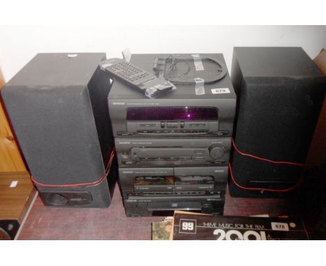 A Kenwood two part modular stereo system comprising graphic equaliser, stereo amplifier, twin cassette deck and CD player - s