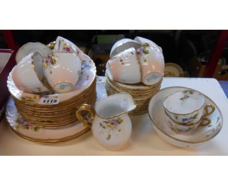 An Edwardian Springer &amp; Co Elbogean porcelain part tea service in the Mignon pattern including trios, bread and butter pl