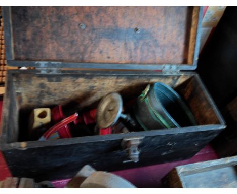 An old wooden toolbox with painted finish containing a quantity of collectable items including turned wooden painted candlest