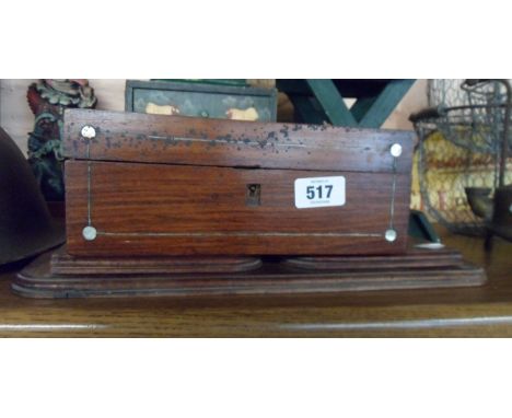 A rosewood veneered workbox carcass with mother-of-pearl inlay - sold with a mahogany book slide