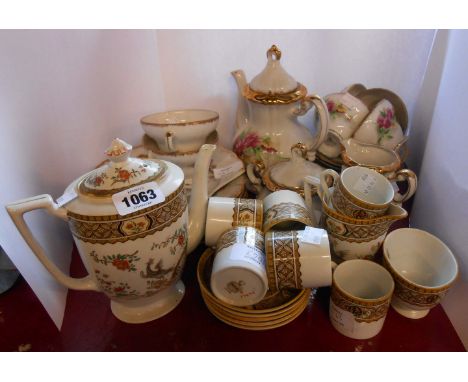 A Mintons coffee set comprising a coffee pot, six coffee cans, five saucers, cream and sugar - sold with a Japanese porcelain