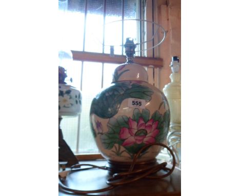 A modern Chinese porcelain lamp of ginger jar form decorated all over with floral pattern