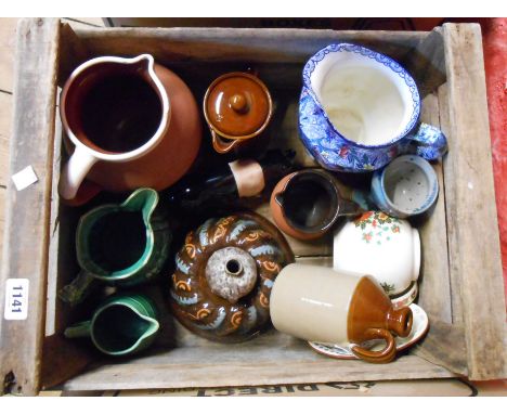 A wooden crate containing a quantity of assorted ceramic items including 20th Century Bovey Pottery Co. pig, West German fat 