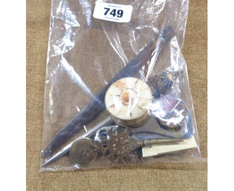 A bag containing a small quantity of collectable items including bottle openers, enamel badges, Devon Constabulary button, et