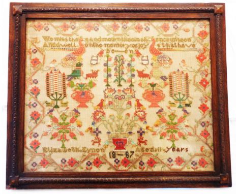 A late Victorian large needlework sampler depicting birds and animals with floral urns and candelabra with motto to top We Mi