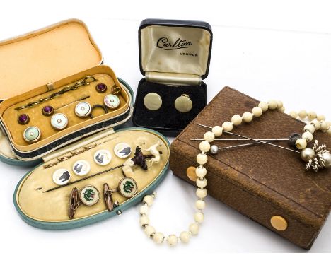 A collection of gentleman's and lady's dress studs, stick pins, cufflinks and buttons, including a carved antler stick pin of