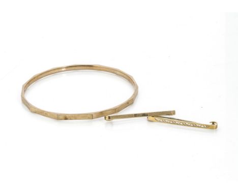 A 9ct gold arm bangle, circular design with faceted decoration, interior diameter 7.5cm, together with two 9ct gold bar brooc