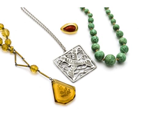 A large quantity of costume jewels, including a simulated jade necklace, various beads and other items 