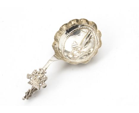 A late 19th century Dutch silver caddy spoon, having figure of a lady to well, marked 930 and with import marks for London 18