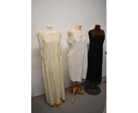 Two early 20th century petticoats and a silk nightdress with the letter 'R' monogrammed to front of bodice.