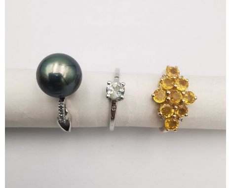 Three 20th century 9 carat gold gem-set rings, a black cultured pearl ring (pearl detached), a Citrine cluster ring and a Pra