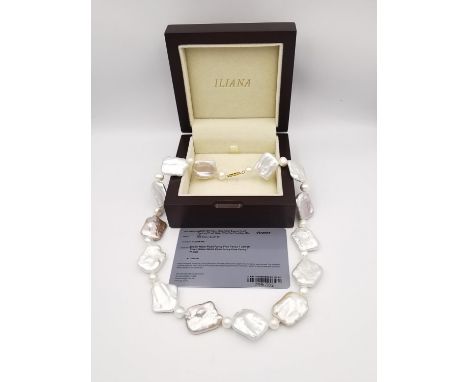 A boxed AAAA Keshi pearl and fresh water white pearl necklace with 18 carat yellow gold clasp. The baroque Keshi pearls with 