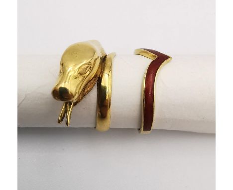Two 18ct yellow gold rings, one carved in the form of a coiled snake and the other a V-shaped band with red enamel. Snake rin