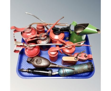 A tray of vintage oil cans 