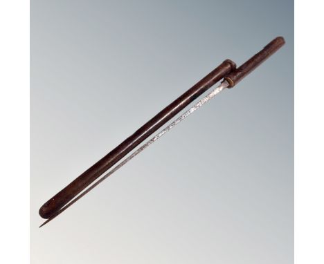 A sword stick in leather case 