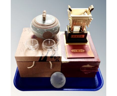 A Chinese three-piece tea bowl set, boxed, together with an incence burner and glass globe paperweight 