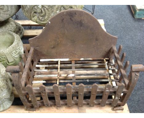 A Victorian cast iron fire grate 