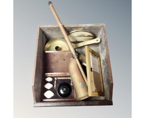 An antique wooden drawer containing brass candlestick, vintage magnifying set in mahogany case, brass double horn