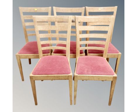A set of five contemporary oak ladder backed chairs 