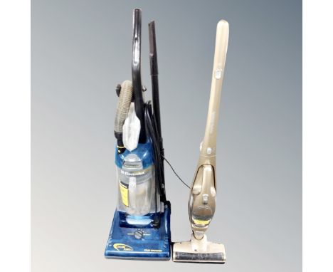 An Electrolux cyclone vacuum together with Morphy Richards stick vacuum with stand 