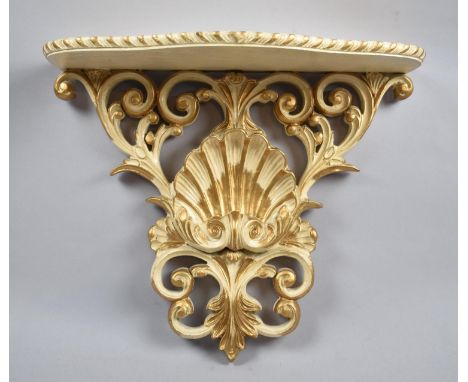 A Mid 20th Century Cream and Gilt Wall Sconce Shelf with Shell Decoration, 36cm Wide 