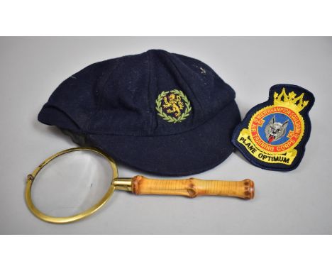A Bamboo Handled Magnifying Glass, Vintage School Cap Retailed by Harrods and a Wolverhampton Air Training Corps Badge 