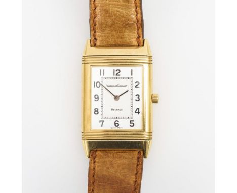  Goldene "Reverso"-Armbanduhr in Originaletui. Jaeger-LeCoultre. Verkaufbeleg und Garantieschein vom 02.10.1990. Modellnr. 14