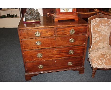 A 19th century mahogany chest of two short over three long graduated drawers with brass drop handles and oval back plates, on