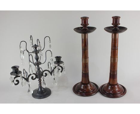 A pair of brass bound mahogany candlesticks bearing paper labels to base Messrs W &amp; F Brown &amp; Co, Cabinet Makers, 40c