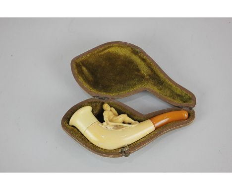 A Meerschaum pipe with carved figure of a seated man, in case, (parts detached), 10cm