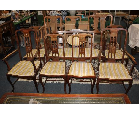 An Edwardian Art Nouveau seven-piece drawing room suite of settee, four single and two elbow chairs with rail backs and mothe