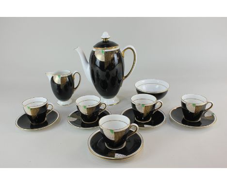 An Art Deco Royal Doulton porcelain part coffee set in Tango pattern, comprising coffee pot (a/f), cream jug, sugar bowl, fiv