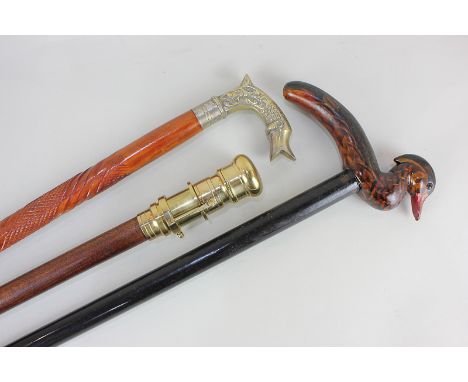 Three various walking sticks to include a novelty walking stick, with brass handle converting to a small telescope, 93.5cm