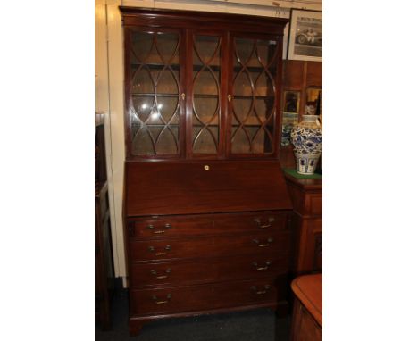 A George III mahogany bureau bookcase with associated line inlaid panel glazed top with two doors enclosing three shelves, ab