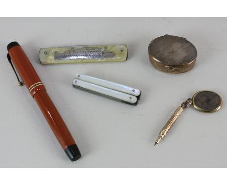 A Parker Duofold fountain pen with 14k gold nib, a penknife depicting a ship marked Rangitiki, a gilt pencil with locket, a t