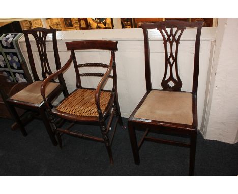 A Victorian elbow chair with bobbin rail back and cane seat, together with a pair of Chippendale style ribbon splat dining ch
