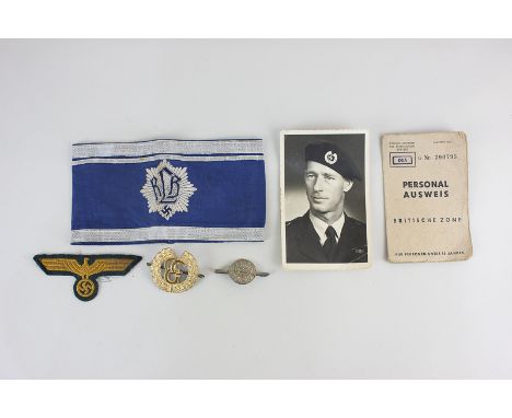 A German Second World War RLB Leader armband, together with an identity card to Marion Birkner, a black and white photograph 