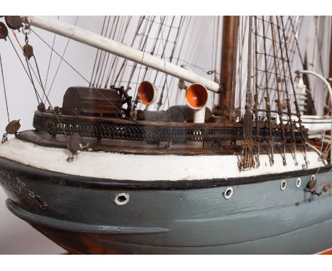 A cased scale model of the sailing ship 'Cicely': standing and running rigged over planked deck with capstan, wheel house, fu