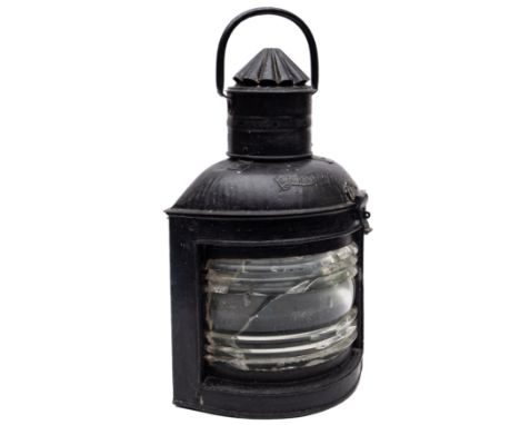 A late 19th century black over painted starboard lamp:, swing handle over circular fluted chimney and clear glass lens, 59cm 