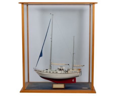 A cased 1/2 scale model of the 38ft sailing yacht 'If And When II', maker Tony Carey: standing rigged over detailed decks wit