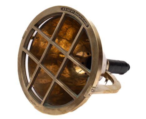 A brass diver's light: the 12 inch housing with guard stamped 'NS cat No. 0583/412-8481' with double square section bar strut