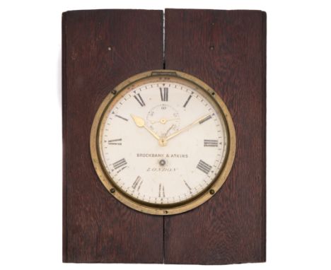 Brockbank &amp; Atkins, London. A brass bulkhead clock: having an eight-day duration timepiece movement, the white painted di