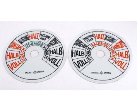 A pair of German 12 1/4 inch  opaque glass engine telegraph  dials by E A Sckell, Stettin with black, red and green text, sig
