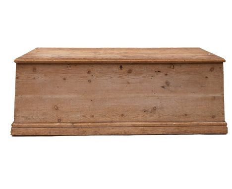 A large pine trunk: fitted iron drop handles to either side, 56 x 159 x 68cm.