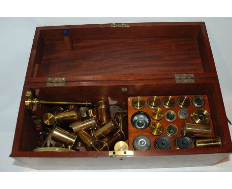 A collection of various microscope lenses etc in mahogany case Condition Report: Available upon request