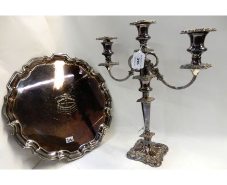 A lot comprising a silver plated three-light candelabrum and an EP salver, 40cm high and 36cm diameter Condition Report: Avai