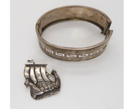 A Hamish Dawson Bowman Viking longship brooch, and a silver bangle Condition Report: Not available for this lot